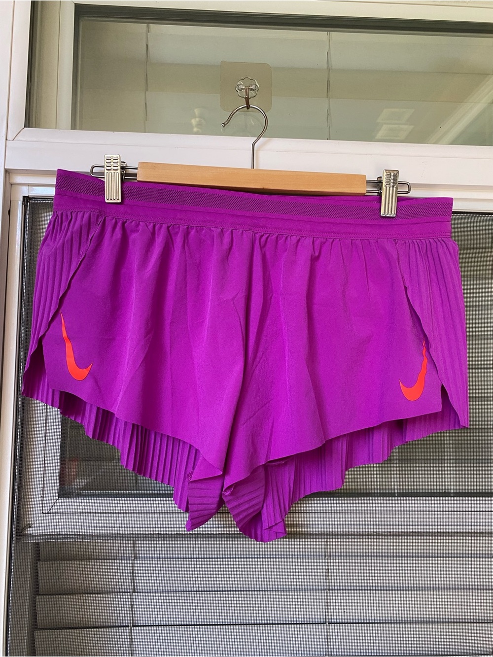 Nike Women's Magenta Athletic Shorts with Orange Swoosh